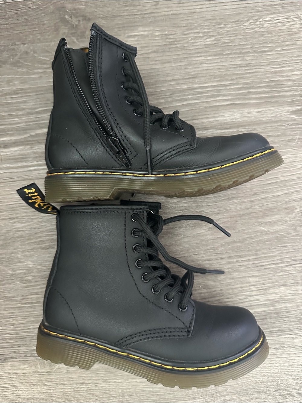 Dr. Martens Kids Black Leather Combat Boots with Yellow Stitching